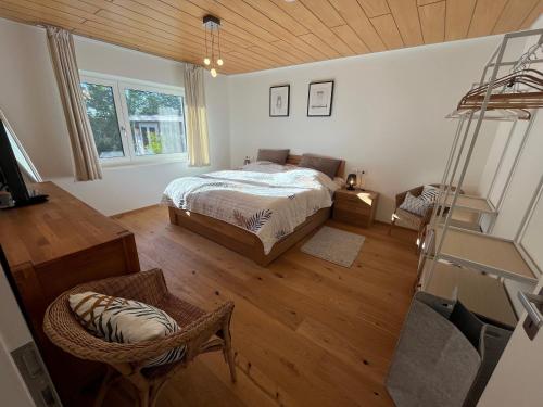 a bedroom with a bed and a wooden ceiling at Ferienwohnung am Rotmannsweg in Marbach am Neckar