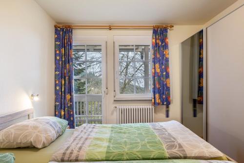 a bedroom with a bed and a window at Schornhof in Oberwolfach