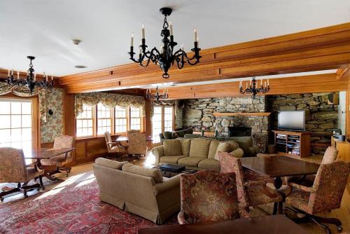 a living room with a couch and a table at Windham Hill Inn in West Townshend