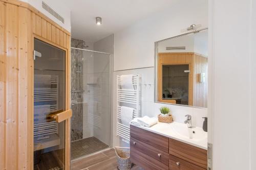 a bathroom with a sink and a shower at Villa Seebrise in Göhren-Lebbin