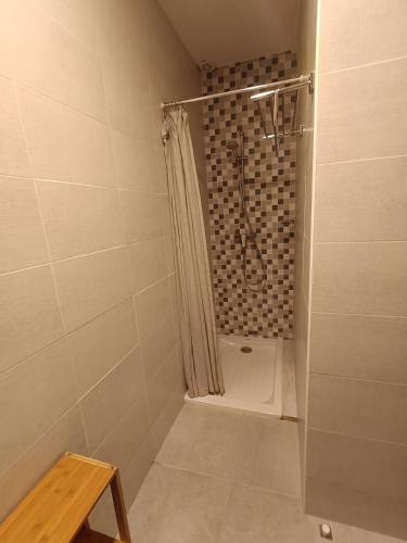a bathroom with a shower with a shower curtain at Apartamento Natalia in Menorca