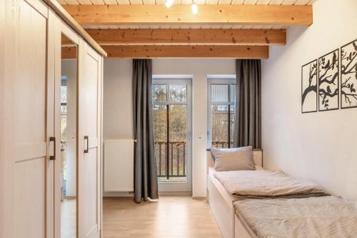 a bedroom with a bed and a window at Ferienhaus Hof Schäfer in Waldeck