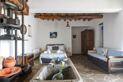 a living room with a bed and a sink at Olive Guesthouse near farm in Fállika