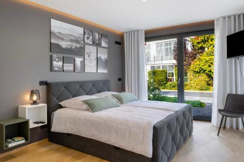 a bedroom with a large bed and a window at Ferienhaus Buwesch 13 in Nüsttal