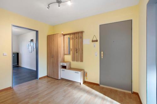 an empty room with a door and a hallway at Lieblingsplatz in Küssaberg