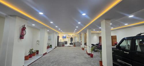 a hallway of a building with a car parked in it at Hotel Sunrise Muzaffarpur in Muzaffarpur