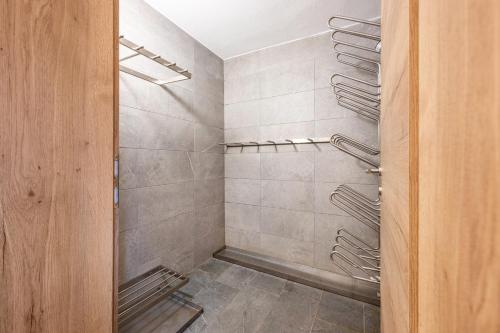 a walk in shower in a bathroom at Good Life Top 3 in Saalbach-Hinterglemm