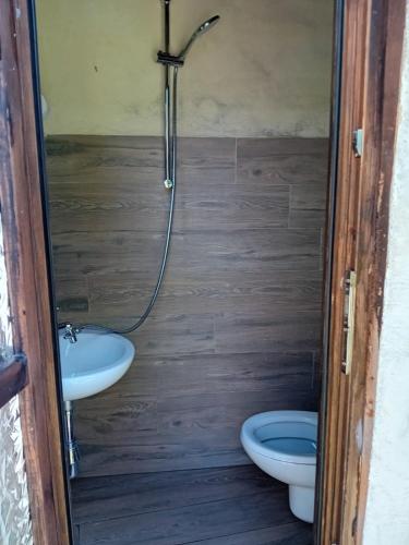 a bathroom with a shower and two toilets in it at Glamping C Selva Tenda Quercia in Piano Porlezza