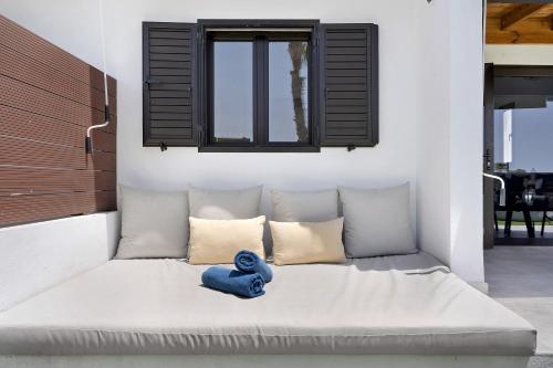 a blue stuffed animal sitting on a couch in a room at Casa Luna Kingbed and Jacuzzi in Maspalomas