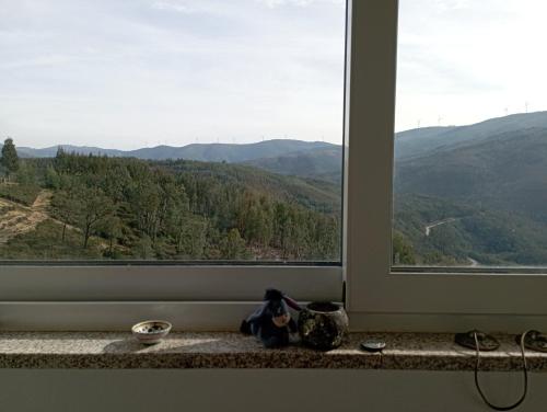 a window with a view of a mountain view at Refúgio da Montanha in Sobral