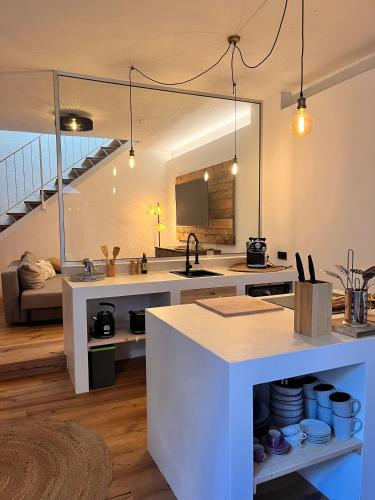 a kitchen with a sink and a counter top at Casa Storica Gardola in Tignale