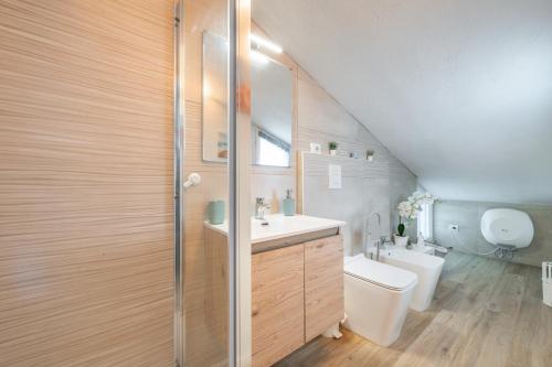 a bathroom with a sink and a toilet in a attic at Al Chiaro di Luna in Decimomannu