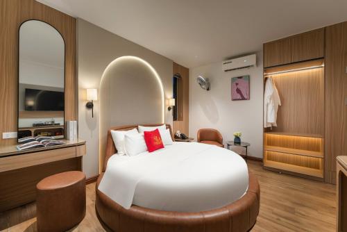 a bedroom with a large white bed in a room at Lam Anh Hotel 10 Ngoai Giao Doan in Hanoi