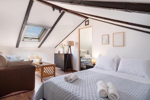a bedroom with a white bed with towels on it at Nikiana hideaway in Nikiana