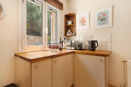a kitchen with a counter and a window at Nikiana hideaway in Nikiana