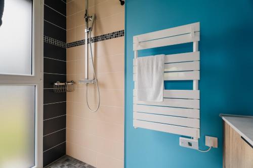 a bathroom with a shower and a sink at Villa de standing piscine 10 pers in Bruz