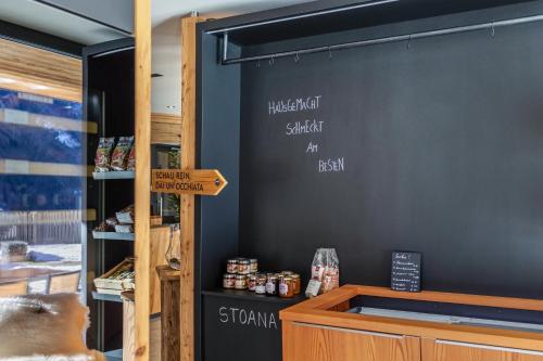 a restaurant with a chalkboard on the wall at Stoana Apt 2-1 in San Giacomo