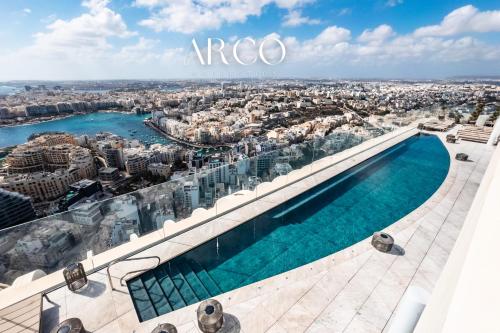 a view of the city from the top at Luxury Little Gem Mercury Tower w Rooftop Pool By Arco Collection in St. Julianʼs