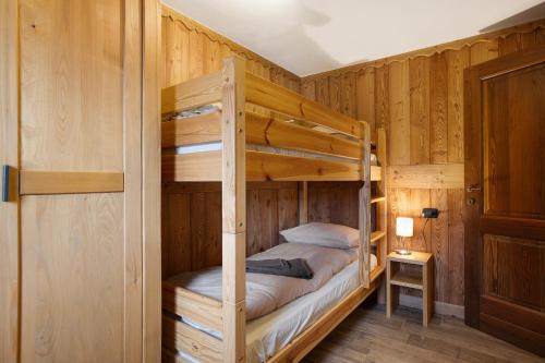 a bedroom with two bunk beds in a cabin at Torre St Orso 4061 Maison Gerard in Cogne