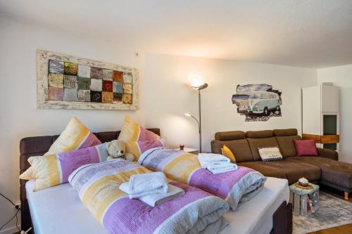 a living room with a couch and two beds at Zentrale Ferienwohnung mit Balkon in Bad Liebenzell