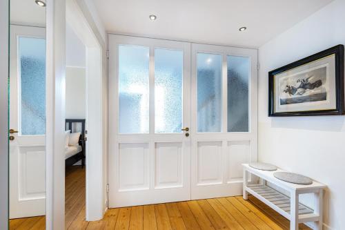 a white room with a white door and windows at Attendorner Burgblick in Attendorn