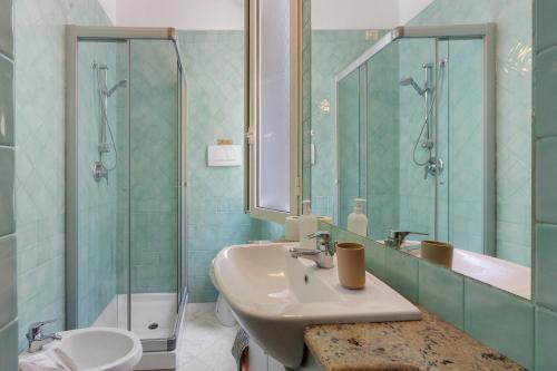 a bathroom with a sink and a shower at Affittacamere Borgo Trento in Verona
