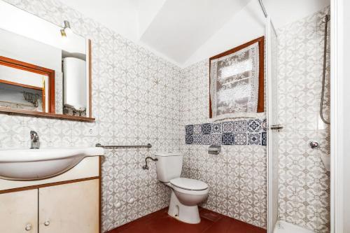 a bathroom with a toilet and a sink at Cavall Menor in Cala Morell