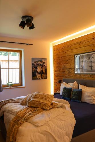 a bedroom with two beds and a ceiling fan at Chalet Almblick mit Sauna in Tauplitz