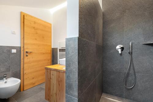 a bathroom with a shower and a sink at Kardinerhof in Collalbo