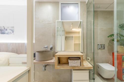 a bathroom with a sink and a toilet and a shower at Albir Playa in Alfaz del Pi