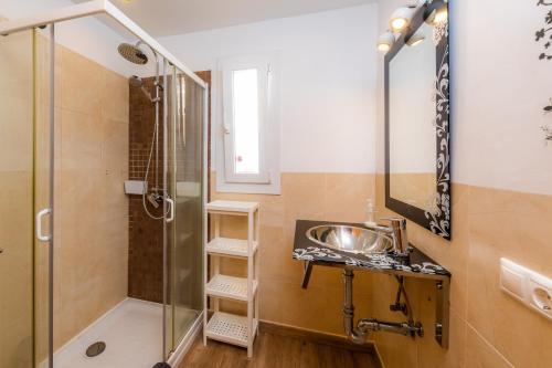 a bathroom with a shower and a sink at Nikydan in Cala d´Or