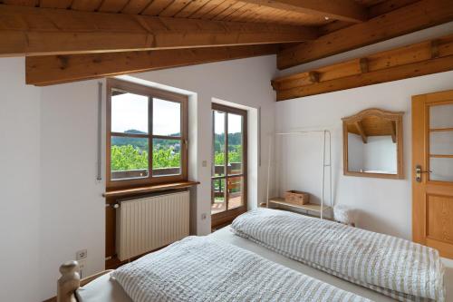 a bedroom with a bed and a window at Felsenland Idyll in Erfweiler