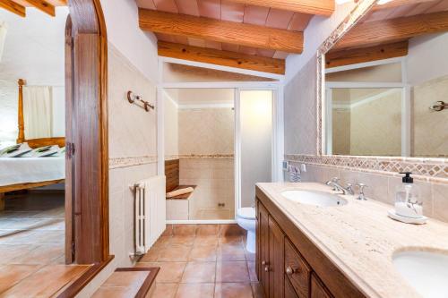 a bathroom with a sink and a toilet at Yuma in Llucmajor
