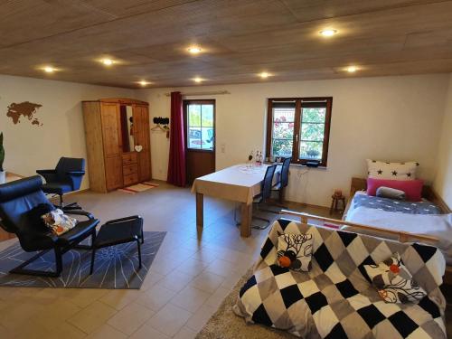 a living room with a couch and a table at Haus Sonnenblume in Weilheim