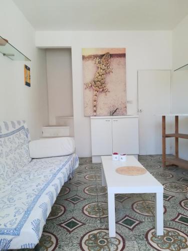 a living room with a couch and a table at Vista Castello - Otranto in Otranto