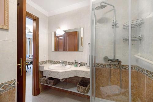 a bathroom with a sink and a shower at Alpispa in Arrecife