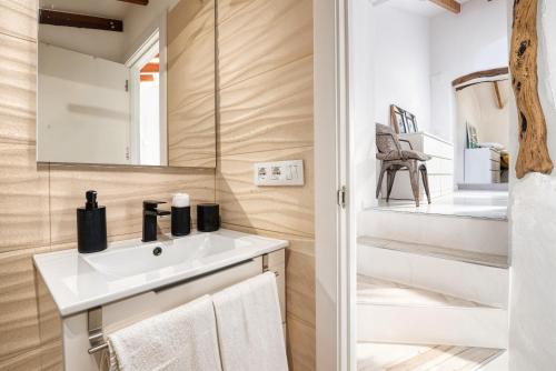 a bathroom with a sink and a mirror at Mirasol in Benitachell