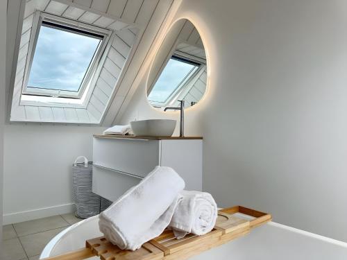 a bathroom with a sink and a mirror at Ker Mam - Belle-Ile in Sauzon