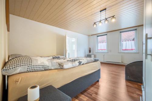 a bedroom with a large bed in a room at Ferienwohnung Bartölke in Bockenem