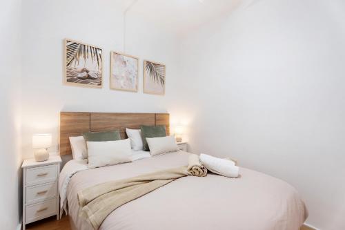 a bedroom with two beds with white walls at Olas del Atlántico in Tacoronte
