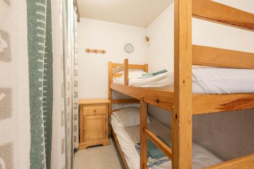 a bunk bed room with two bunk beds at T2 Bis - centre Barèges - cure in Barèges