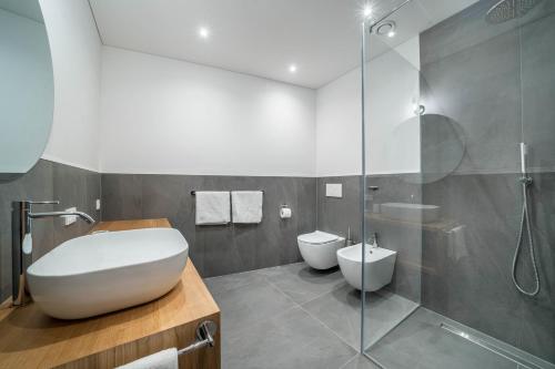 a bathroom with a toilet and a shower at Naturapartments Alpreid Altholz in San Pancrazio dʼUltimo