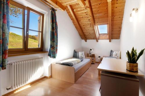 a living room with a couch and a window at Melcherhof in Trodena