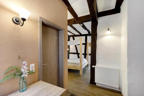 a hallway with a door and a room with a bedroom at Traumschlüsselchen in Braubach