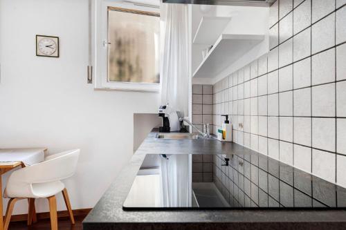 a kitchen with a sink and a counter at Haus Marlene in Cornedo all'Isarco