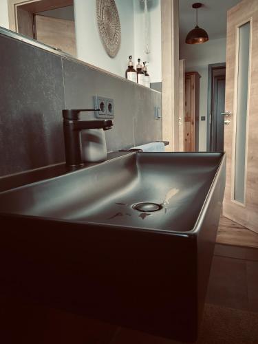 a kitchen with a sink in the middle of it at Zone 3 in Erfurt