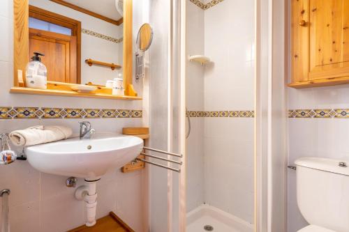 a bathroom with a sink and a toilet at Sa Torre in Port de Soller