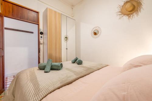 a bedroom with a bed with two towels on it at Sa Torre in Port de Soller