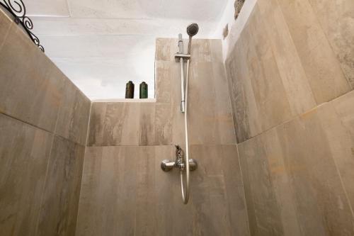 a shower stall in a bathroom with a shower at Esencia Eco-rústico Adults Only in El Charco