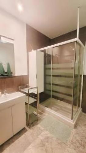 a bathroom with a glass shower and a sink at Ola De Mar - Estepona in Estepona
